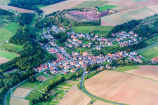Village - view on the edge of agricultural fields and farmland in Wuestenzell in the state Bavaria, Germany