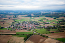 Village - view on the edge of agricultural fields and farmland in Uettingen in the state Bavaria, Germany
