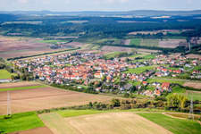 Village - view on the edge of agricultural fields and farmland in Staffelbach in the state Bavaria, Germany