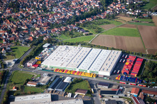 Oblique view of Industrial estate and company settlement Gewerbegebiet An of Siechkapelle in Knetzgau in the state Bavaria, Germany