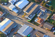 Oblique view of Industrial area Am Kleinwald from the southeast with embroidery Rieder and Getränke-Trauth GbR Owner N. & C. Lachomski in Herxheim bei Landau in the state Rhineland-Palatinate, Germany