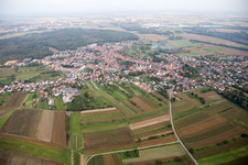 Village - view on the edge of agricultural fields and farmland in Gries in Grand Est, France