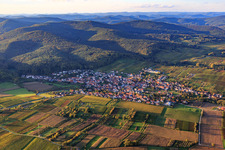 Village view between autumnal vineyards from the south in Oberotterbach in the state Rhineland-Palatinate, Germany