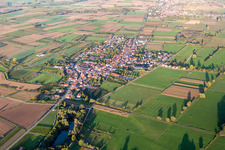 Village - view on the edge of agricultural fields and farmland in Schweighofen in the state Rhineland-Palatinate, Germany