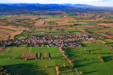 Village overview between autumnal fields and meadows from the south in Schweighofen in the state Rhineland-Palatinate, Germany