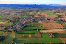 Village view between autumnal fields and meadows from the south in Kapsweyer in the state Rhineland-Palatinate, Germany