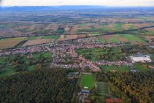 Village overview between autumnal fields and meadows on the edge of the Bienwald forest from the south in the district Schaidt in Wörth am Rhein in the state Rhineland-Palatinate, Germany