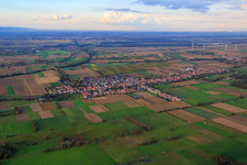 Village overview between autumnal fields and meadows on the Viehstrich from the south in Freckenfeld in the state Rhineland-Palatinate, Germany