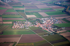 Village - view on the edge of agricultural fields and farmland in Kleinniedesheim in the state Rhineland-Palatinate, Germany