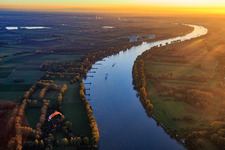 Course of the Rhine south to the Biblis nuclear power plant at sunset in Gernsheim in the state Hesse, Germany