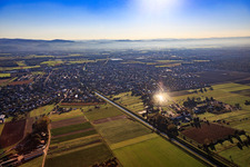 View of the village on the Weschnits from the west at sunrise in the district Kleinhausen in Einhausen in the state Hesse, Germany