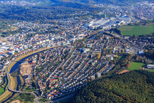 Aerial photograpy of View of the town from both sides of the Murg river from the southwest in front of the Daimler Truck AG factory premises in Gaggenau in the state Baden-Wuerttemberg, Germany