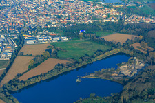 The quarry lake of the Schempp gravel works and asphalt mixing works in the district Neureut in Karlsruhe in the state Baden-Wuerttemberg, Germany