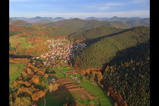 Village view in the autumnal Palatinate Forest from the west in Vorderweidenthal in the state Rhineland-Palatinate, Germany