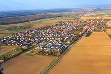 Village overview in winter on the B427 from the east in Minfeld in the state Rhineland-Palatinate, Germany