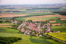 Village - view on the edge of agricultural fields and farmland in Vasbuehl in the state Bavaria, Germany