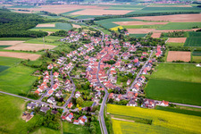 Village - view on the edge of agricultural fields and farmland in Stettbach in the state Bavaria, Germany