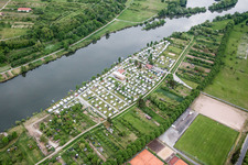 Camping Ankergrund with caravans and tents at the Main river in Volkach in the state , Germany