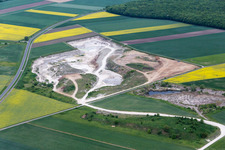 Aerial view of Site and tailings area of the gravel mining of Concrete-manufacturer in Sulzheim in the state Bavaria, Germany