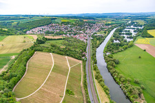Railway and B26 lead along the Main riverbank to the southwest in Schonungen in the state Bavaria, Germany