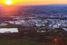 Aerial view of Industrial area HAFEN WEST and HAFEN OST behind the A70 at sunset in Schweinfurt in the state Bavaria, Germany