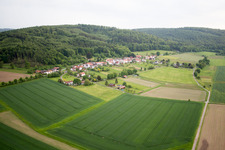 Village - view on the edge of agricultural fields and farmland in Oberweser in the state Hesse, Germany