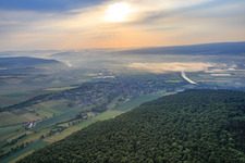 View of the town in the morning mist from the west in the district Albaxen in Höxter in the state North Rhine-Westphalia, Germany