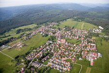 Aerial photograpy of Village - view on the edge of agricultural fields and farmland in Dobel in the state Baden-Wurttemberg