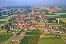 View of the town from the east with the water tower in the district Niederlustadt in Lustadt in the state Rhineland-Palatinate, Germany