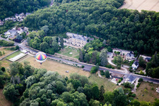 Hot air balloon launch in front of Chateau de Perreux in Nazelles-Negron in Centre-Val de Loire, France from above