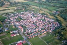 Aerial photograpy of Village - view on the edge of agricultural fields and farmland in Venningen in the state Rhineland-Palatinate, Germany