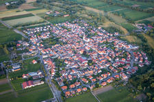 Oblique view of Village - view on the edge of agricultural fields and farmland in Venningen in the state Rhineland-Palatinate, Germany