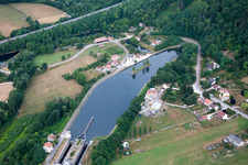 Channel flow through tunnel and river banks of the waterway shipping Rhine to Marne channel in Foug in Grand Est, France