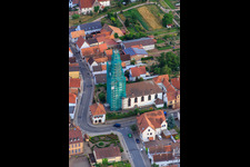 Catholic church scaffolded by Leidner GmbH Gerüstbau, Landau in Ottersheim bei Landau in the state Rhineland-Palatinate, Germany from the plane