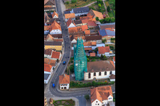 Bird's eye view of Catholic church scaffolded by Leidner GmbH Gerüstbau, Landau in Ottersheim bei Landau in the state Rhineland-Palatinate, Germany