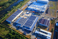 Oblique view of Oberwald industrial area with SKA Sitze GmbH, WAS Logistics, Com Transporte GmbH and NUSS Group in Wörth am Rhein in the state Rhineland-Palatinate, Germany