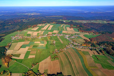 Aerial view of Village - view on the edge of agricultural fields and farmland in Wuerzberg in the state Hesse, Germany
