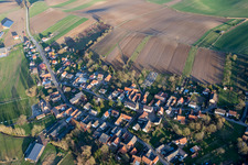 Village - view on the edge of agricultural fields and farmland in Siegen in Grand Est, France