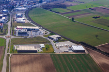 Aerial view of Industrial area in the Speyer Valley with ITK Engineering GmbH, Resinnovation GmbH, TRANSAC International Shipping Company Ltd., and Markthalle 5 in Rülzheim in the state Rhineland-Palatinate, Germany
