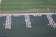 Aerial photograpy of Pleasure boat marina with docks and moorings on the shore area der Adria in Goro in Emilia-Romagna, Italy