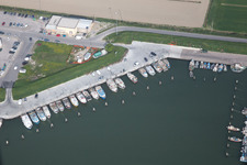 Oblique view of Pleasure boat marina with docks and moorings on the shore area der Adria in Goro in Emilia-Romagna, Italy