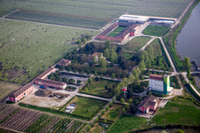 Farm on the edge of cultivated fields in Lodigiana in Emilia-Romagna, Italy
