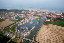 Aerial view of Pleasure boat marina with docks and moorings on the shore area Marina di Porto Reno in Casalborsetti in Emilia-Romagna, Italy