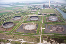 Tanks, power plants and exhaust towers of the oil-fired power plant at the mouth of the Po in the district Centrale Enel in Porto Tolle in the state Rovigo, Italy