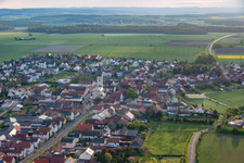 Aerial view of Village - view on the edge of agricultural fields and farmland in Grettstadt in the state Bavaria, Germany