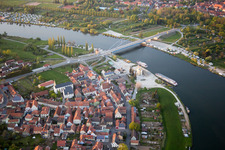 Pier with excursion boats on the Main in front of the Main Bridge Volkach in the district Astheim in Volkach in the state Bavaria, Germany