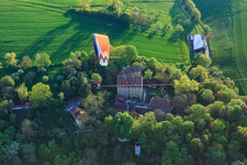 Klingenberg Castle with paraglider in Wipfeld in the state Bavaria, Germany
