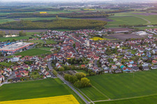 Aerial photograpy of Village - view on the edge of agricultural fields and farmland in Grettstadt in the state Bavaria, Germany