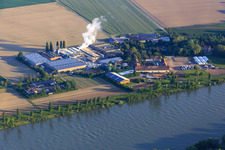 Intersnack Deutschland SE plant in Petersau on the banks of the Rhine and Carlo von Opel riding school at the Demeter Hofgut Petersau in the district Mörsch in Frankenthal in the state Rhineland-Palatinate, Germany