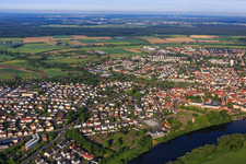 City overview on the banks of the Main from the east with monastery garden Seligenstadt in Seligenstadt in the state Hesse, Germany